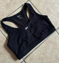 Top deportivo reebok negro logo pequeño